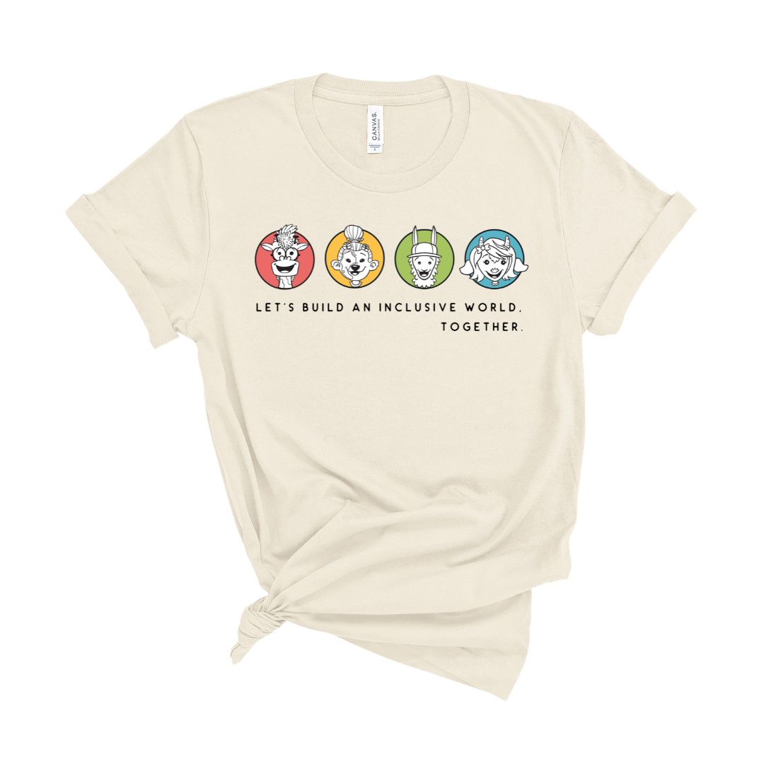 A beige colored t-shirt with graphics and text that reads 'LET'S BUILD AN INCLUSIVE WORLD TOGETHER' accompanied by colorful cartoon-like images of Able Fables character faces.